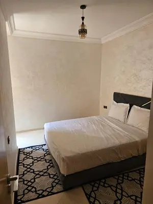 a bedroom with a large bed in a room at View Marrakech Apartment in Marrakech
