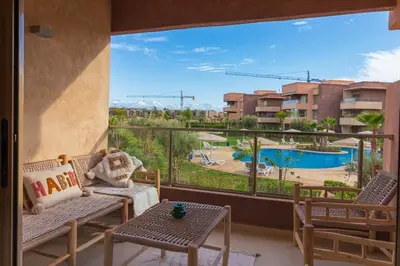 a balcony with a view of a pool at Marrakech prestigia in Marrakech