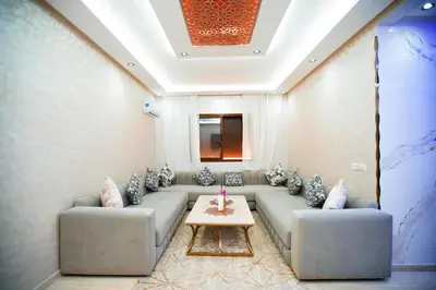 a living room with a couch and a table at New apartment rental in Marrakech