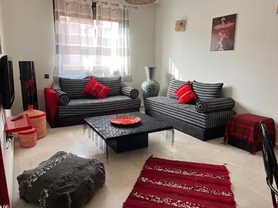 a living room with two couches and a table at Mimi MARRAKECH in Marrakech