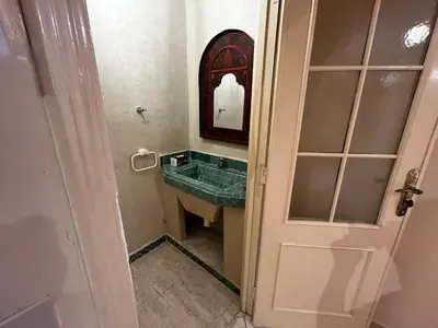 a bathroom with a sink and a mirror at Dreams in Marrakech in Marrakech