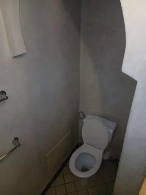 a bathroom with a white toilet in a stall at Dreams in Marrakech in Marrakech