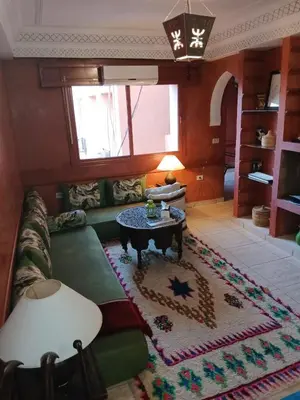 a living room with a couch and a table at Dreams in Marrakech in Marrakech