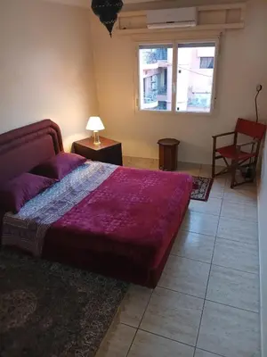 a bedroom with a large bed and a window at Dreams in Marrakech in Marrakech