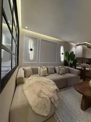 a living room with a couch and a rug at Atlas-Si Cosy Appart Carré Eden in Marrakech