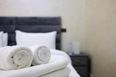 a pile of towels sitting on top of a bed at Comfort and Simplicity in Marrakech in Marrakech