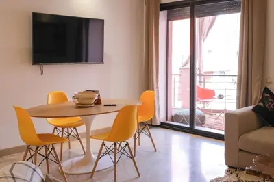 a living room with a table and chairs and a couch at 