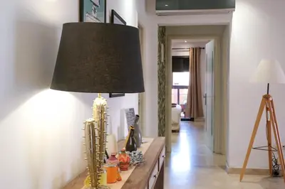 a lamp on a table in a living room at 