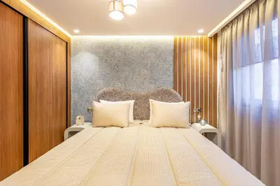a bedroom with a large bed with white pillows at Modern Jewel Central and Premium comfort in Marrakech