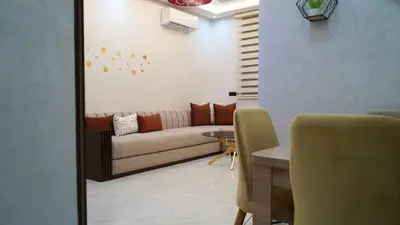a living room with a couch and a table at apartment in the center for an excellent stay in Marrakech