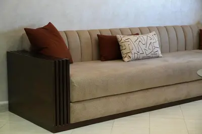 a couch with pillows on it in a room at apartment in the center for an excellent stay in Marrakech