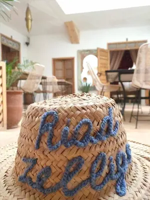 a cake with the word happy written on top of it at Riad Zellige in Marrakech