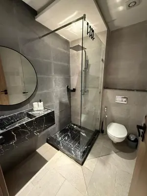 a bathroom with a shower and a toilet at New apartment in Jnane El Guéliz in Marrakech