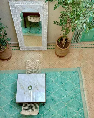 an aerial view of a mirror and a table in a room at Riad El Badun in Marrakech