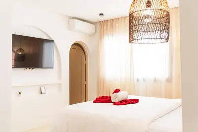 a bedroom with a bed with a teddy bear on it at Architect's studio in the city center! in Marrakech