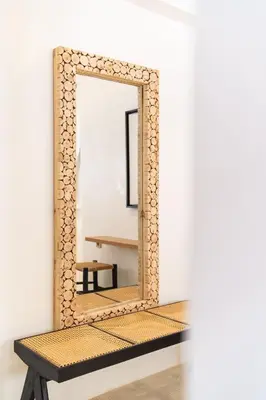 a mirror on a bench in a room at Architect's studio in the city center! in Marrakech
