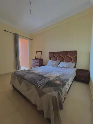 a bedroom with a bed and a window at Apartment 5 minutes from the airport in Marrakech