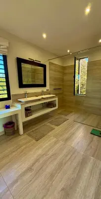 a bathroom with a sink and a mirror at CASA EDEN - Serenity and elegance between Atlas mountains and city center in Marrakech