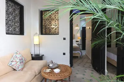 a living room with a couch and a table at riad NAMLA in Marrakech