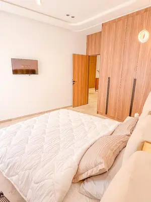 a large white bed in a white room at Studio haut standing in Marrakech
