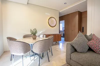 a dining room with a table and chairs at Your Tiny Paradise - Marrakech - Prestigia in Marrakech
