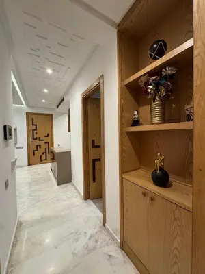 a hallway with wooden shelves and a room with a vase at Chic 2BDR Apartment in Gueliz in Marrakech