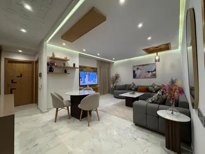a living room with a couch and a table at Chic 2BDR Apartment in Gueliz in Marrakech