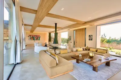 a living room with a couch and a table at Villa youngLA in Sehib Foukani