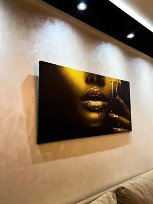 a picture of a woman hanging on a wall at Studio Rolex Guéliz, situé à seulement 5 minutes de la place Jemaa El-Fna in Marrakech