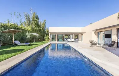 a swimming pool in the backyard of a house at Villa Atlas piscine chauffee sans vis a vis in Marrakech