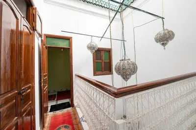 a hallway with balls hanging from the ceiling at Dar Tbib in Marrakech