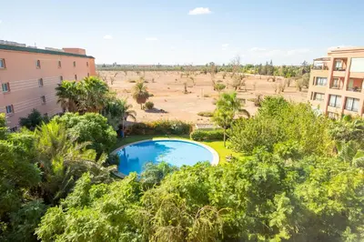 an overhead view of a swimming pool in a field at Luxury 2 BDRM in Hivernage with Pool and Garden in Marrakech