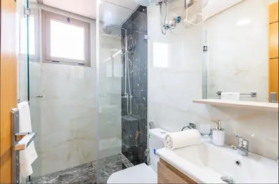 a bathroom with a shower and a toilet and a sink at Cosy studio au cœur de Marrakech in Marrakech