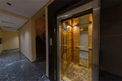 a glass door in a building with a staircase at Chic & comfort in the heart of Marrakech train station in Marrakech