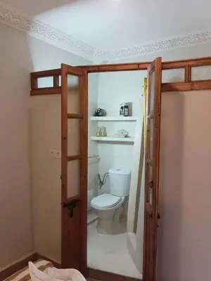 a bathroom with a toilet in a room at Riad Le Bijou de Zahra Marrakech Kasbah in Marrakech