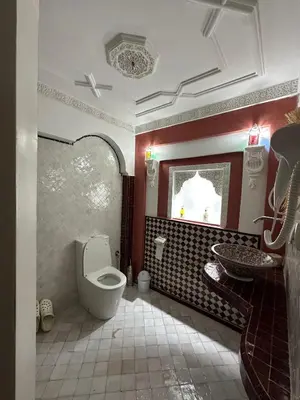 a bathroom with a toilet and a sink at Riad Le Bijou de Zahra Marrakech Kasbah in Marrakech
