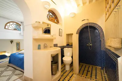 a bathroom with a sink and a toilet and a shower at Dar Kleta in Marrakech