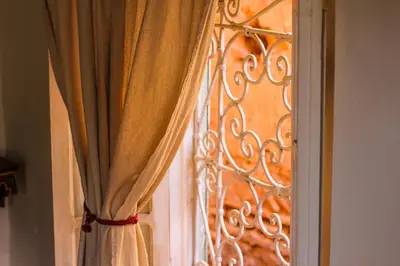 a close up of a window with a curtain at Dar Kleta in Marrakech
