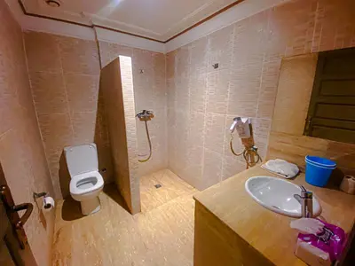 a bathroom with a sink and a toilet at Villa Moyen orient by séjour in Marrakech