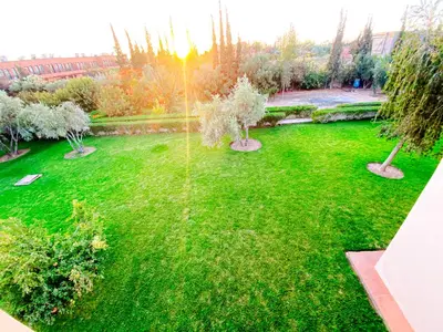 an aerial view of a green yard with trees at Villa Moyen orient by séjour in Marrakech