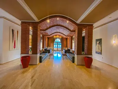 a lobby with couches and tables in a building at Villa Moyen orient by séjour in Marrakech