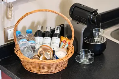 a basket on a counter with bottles and alcohol at Cocon de Guéliz - Central & balcon in Marrakech