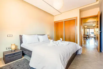 a bedroom with a bed with towels on it at Cocon de Guéliz - Central & balcon in Marrakech
