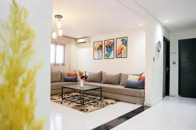 a living room with a couch and a table at Central B1 Chic & Shock , hivernage city center in Marrakech