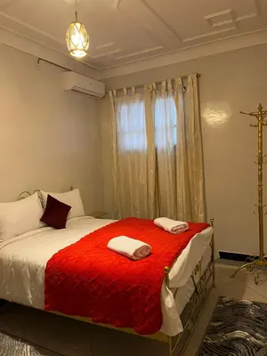 a bedroom with a bed with two towels on it at MarrakLuft in Marrakech