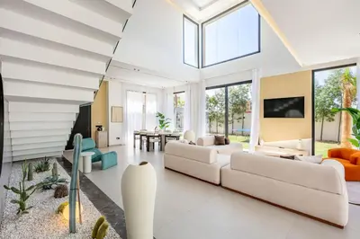 a living room with white furniture and windows at Luxury Villa, Design, Comfort, Heated Pool, Games in Marrakech