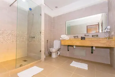 a bathroom with a shower and a sink and a toilet at Emerald palace in Marrakech