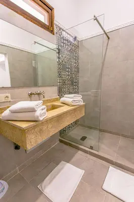 a bathroom with a sink and a shower at Emerald palace in Marrakech