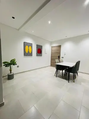 a dining room with a table and chairs at The Pearl Loft, Marrakech Luxury Apartment in Marrakech