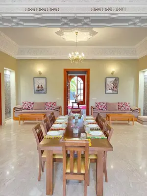 a large dining room with a table and chairs at Villa Dar Zitoune in Marrakech